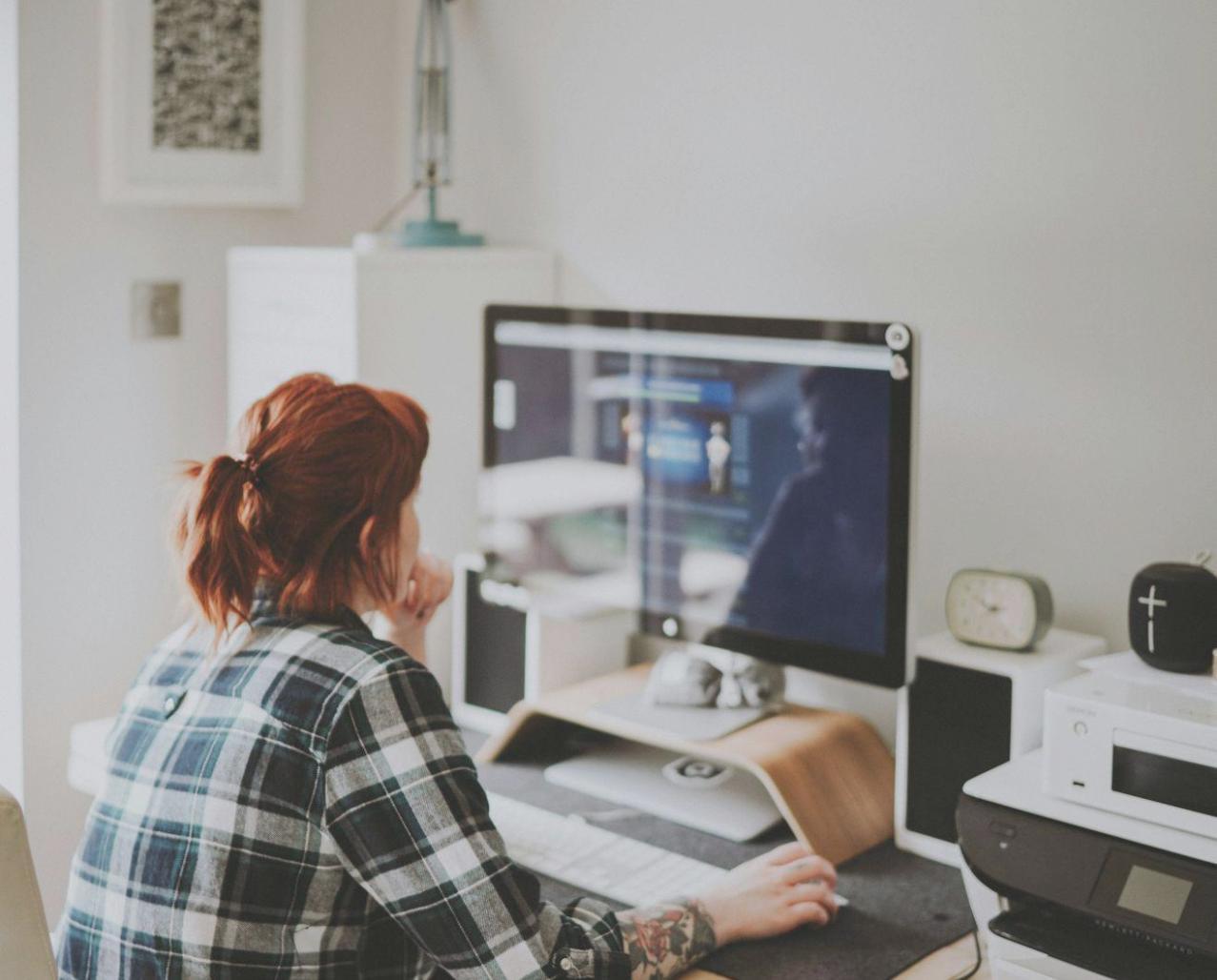 Small group financial workshop session with participants taking notes